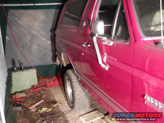 1991 Ford Bronco interior, side view, red exterior paint visible