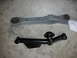 1990 Ford Mustang - Two car suspension control arms are laid out on a concrete surface, likely for a repair or replacement.