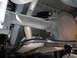 1990 Ford Mustang - Underside view of a 1990 Ford Mustang's rear axle and suspension system, showing a recently installed sway bar.
