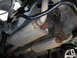 1990 Ford Mustang - Underbody view of a car's dual exhaust system and rear suspension components.