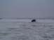 2003 Ford Ranger - A dark SUV navigates a snow-covered landscape under an overcast sky.