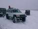 2003 Ford Ranger - Several off-road vehicles are parked in a snowy landscape under an overcast sky.