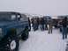 2003 Ford Ranger - A group of people stand around several trucks and a blue SUV in a snowy landscape.