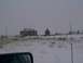 2003 Ford Ranger - Winter scene with a rural building and snow-covered ground.