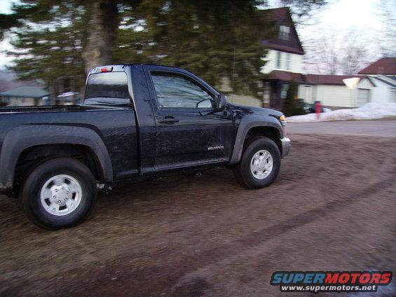 Dark blue pickup truck, side view