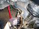 Upper ball joint boot wire fastened and tightened around boot