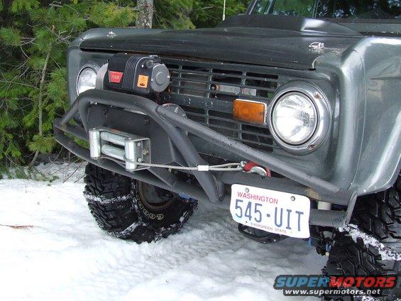 1976 Ford Bronco front end with winch and brush guard in snow. Washington license plate 545-UIT