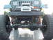 1994 Jeep YJ - Front view of a modified 1994 Jeep YJ showing its suspension and winch system.