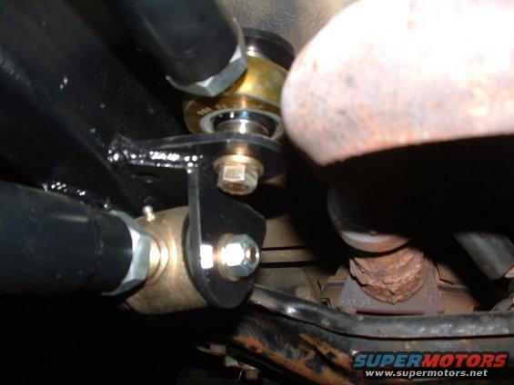 close-up of suspension linkage and exhaust pipe