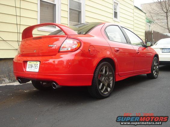 Red 2005 Dodge SRT-4 rear view with large spoiler and dual exhaust