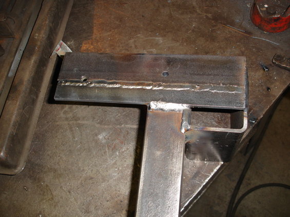 Welded metal bracket with two holes