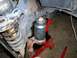Prepping upper bj to be pressed out of knuckle using 36 mm socket with bolt on top