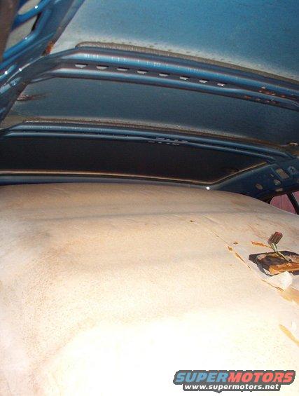 headliner10.jpg Note the steel roof bows used only in P71s.  They're bolted & glued in, and they interfere with civilian headliners.