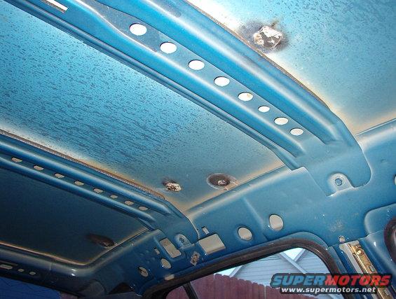 roof02.jpg LHS welded patches, & roof bows used only in P71s. They're bolted & glued in, and they interfere with civilian headliners.