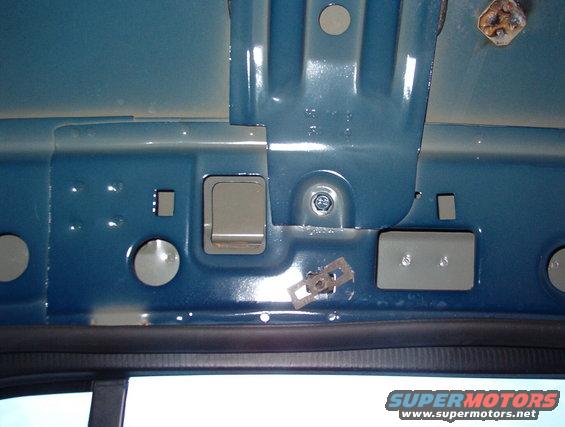 roof03.jpg RHR roof bow.  The 2 small rectangular holes on level with the bolt are for the grab handle.  The clip nut below the bolt is for the hanger hook.