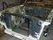 1990 Ford Mustang - This is the engine bay structure of a car, possibly undergoing restoration or repair.