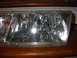 1998 Mercury Grand Marquis - This is a close-up view of a vehicle's headlight assembly, showing internal reflectors and a bulb.