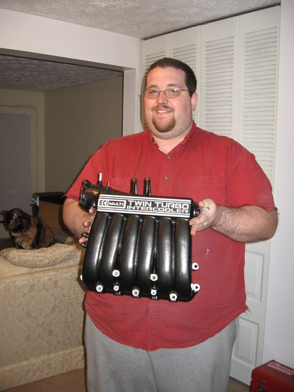 Art Pigate, holding my manifold after his powder coat work... Looks great!