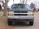 1995 GMC Sierra 1500 - Front view of a 1995 GMC Sierra 1500 pickup truck, showing its chrome grille and headlights.