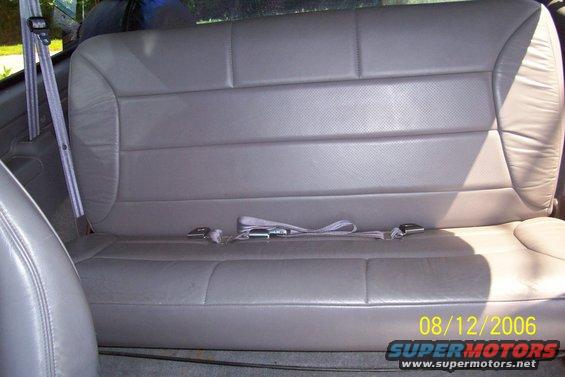 Back seat with gray leather upholstery and seatbelts. Date stamp shows 08/12/2006