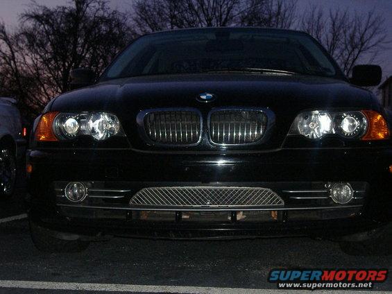 Black 2001 BMW 3 Series front view with chrome grille and fog lights