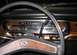 1979 Ford Bronco - The dashboard of a 1978 Ford Bronco shows woodgrain trim and a prominent Ford logo on the steering wheel.