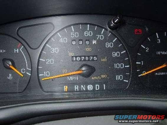 Dashboard gauges with odometer reading 107175 miles