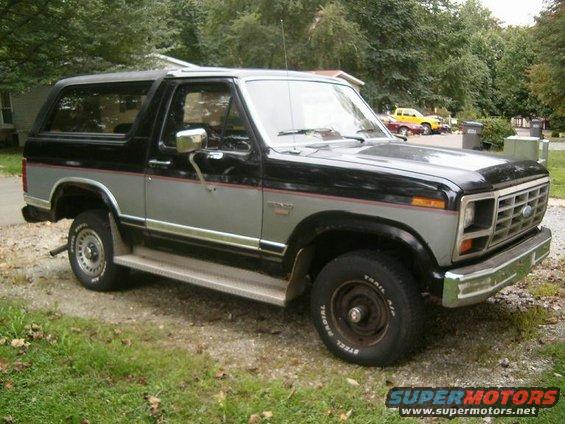 Black and silver SUV with chrome grille and side trim