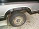 1986 Ford Bronco - The rear wheel well shows significant rust damage, obscuring any specific year identification.