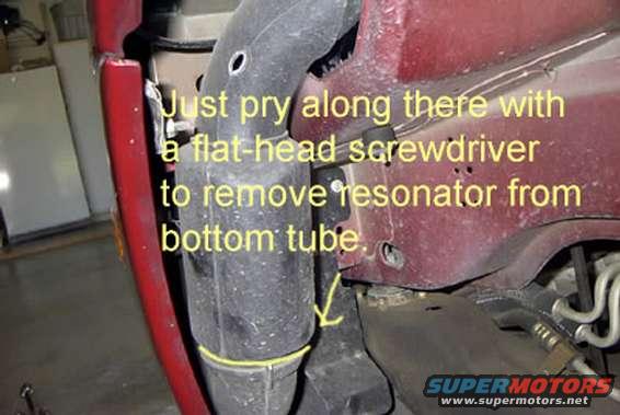 Close-up of a car's undercarriage with text overlay showing installation instructions for a resonator