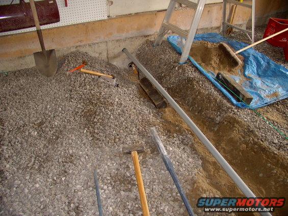 img_0680.jpg 1 1/2" conduit pipe through the wall into the basement for plenty more power to the other side of the garage.