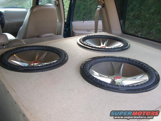 three subwoofers installed in the back of an SUV
