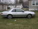 1988 Ford Thunderbird - Side profile of a silver Ford Thunderbird coupe, likely from the late 1980s.