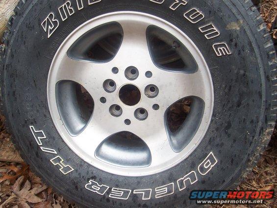 Bridgestone Dueler H/T tire on a five-spoke alloy wheel