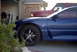 1994 Dodge Stealth - A blue 1994 Dodge Stealth is parked next to a red pickup truck in a driveway.
