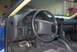 1994 Dodge Stealth - The interior of a 1994 Dodge Stealth features a dark dashboard, steering wheel, and sporty pedals.