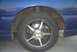 1994 Dodge Stealth - Aftermarket wheels and drilled rotors are visible on the front of this blue vehicle.