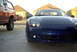 1994 Dodge Stealth - A blue sports car with a distinctive front end is parked in a driveway.