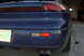 1994 Dodge Stealth - The rear of a blue sports car is shown, dual exhaust pipes and an Oklahoma license plate.