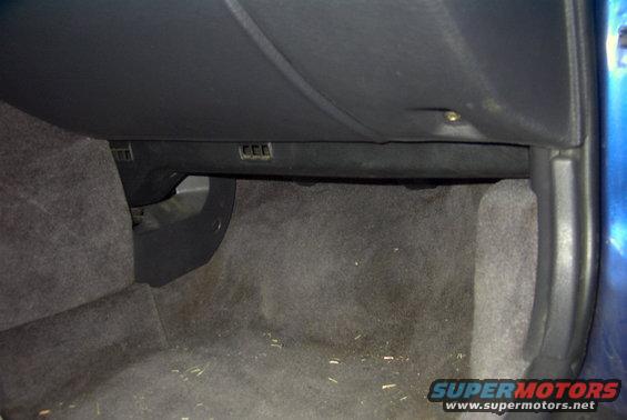 Interior dashboard view of a car, showing the glove compartment area