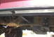 1994 Ford Bronco - Close-up view of the underbody, focusing on the sliders and suspension of a vehicle.