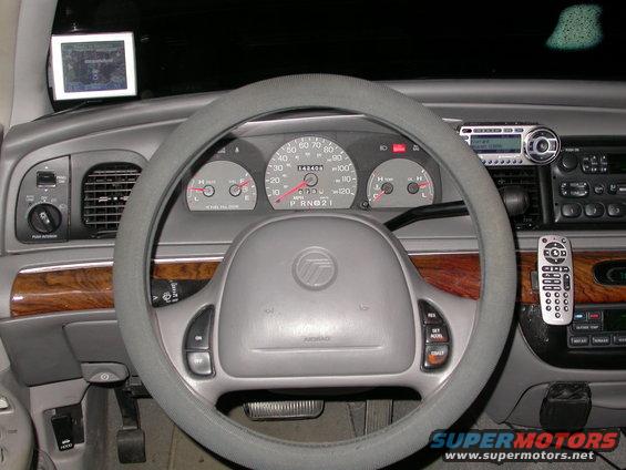 1998 Mercury Grand Marquis interior with dashboard, steering wheel, and radio