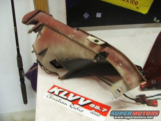 Car part with wiring, KLVV Christian Radio sticker, and Supermotors.net logo