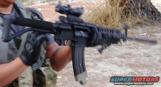 Assault rifle with scope and extended magazine