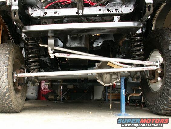 BulletProof Steering from Performance Unlimited....without the track bar drop bracket yet...notice difference of 37inch Pro Comp's on the right of pic, and the original tiny 31inch rubber on left!!