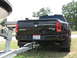 2006 Volkswagen Jetta - Rear view of a black Dodge Ram pickup truck towing a boat trailer.