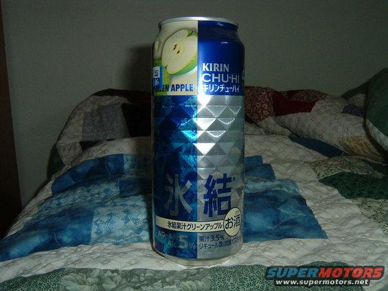 Kirin Chu-Hi Green Apple can on a bed with a patterned quilt