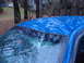 1998 Ford Crown Victoria - The blue car's roof appears to be covered by a tarp, and the windshield is shattered.