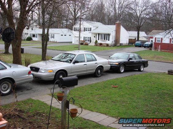Silver 2003 Ford Crown Victoria parked in driveway