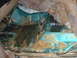 1996 Ford Bronco - The interior floor of a vehicle shows significant rust and corrosion, with some insulation exposed.